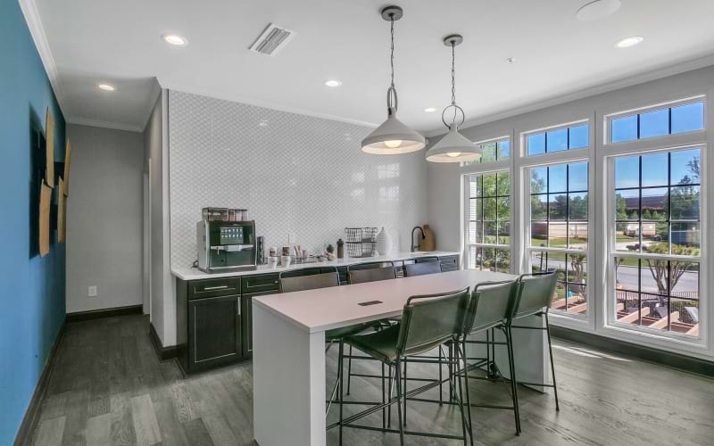 Clubhouse kitchen with island and stools