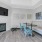Seating area with a fireplace and tv